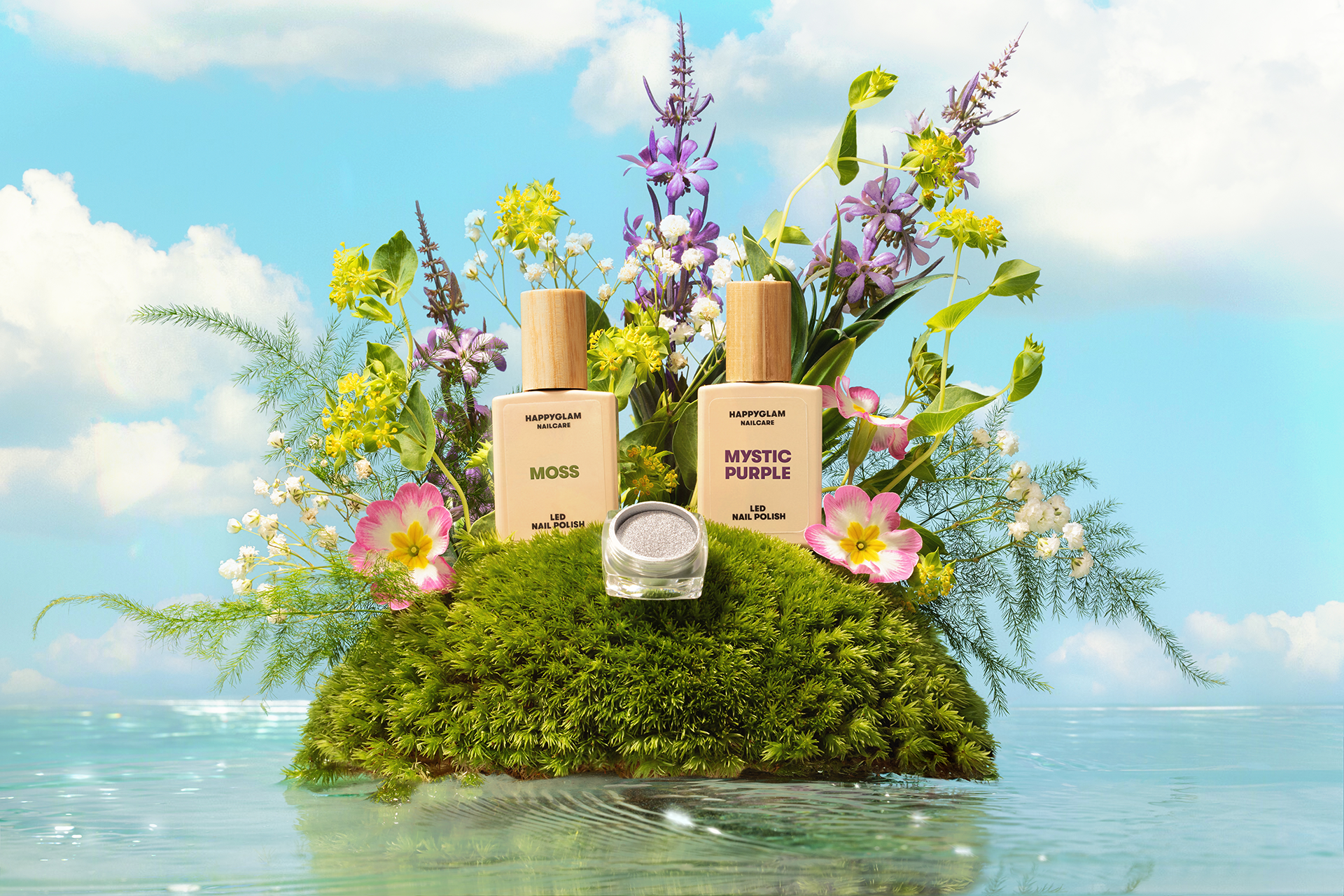 commercial photography depicting two LED nail polish bottles on a green tiny island surrounded by water and blue sky